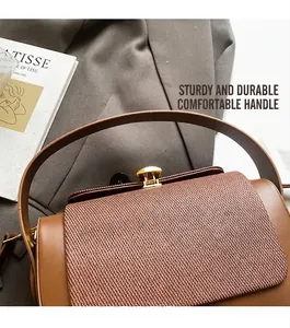 Detail of brown contrast leather box bag with woven flap and retro gold lock