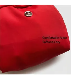 Close-up of red canvas handbag featuring a silver M FASHION circular metal logo detail