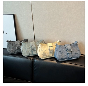 Detail of vintage dumpling shoulder bags in four colors with star and belt buckle charms