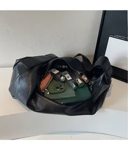 Top view of large black tote bag showing spacious interior with daily essentials