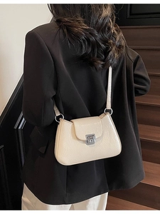 Chic beige wrinkled leather underarm bag with silver twist lock and slim shoulder strap