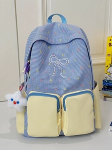 Blue and white plaid school backpack with yellow pockets and star plush keychain pendant