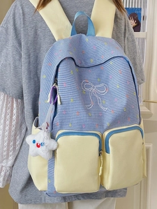 Blue and white checkered school backpack with yellow pockets and a plush star charm