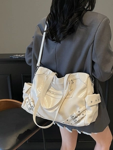 Off-white large tote bag in glossy leather with motorcycle style studs and buckles