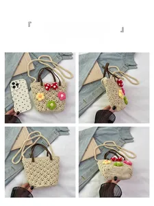 Detail view of woven bag showing 3D crochet flowers and red polka dot bow decoration
