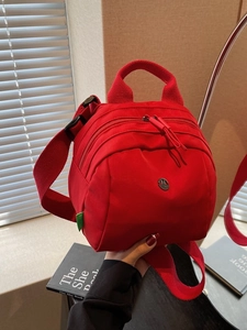 Chic red nylon mini shell bag for women with adjustable straps and top handle design