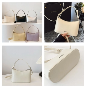 Detail shot of vintage leather dumpling bags in five colors with a brand logo and strap