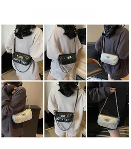 Close-up detail of silver quilted chain bag and black wrinkled leather mini crossbody purse