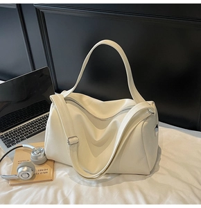 Cream white Boston bag with litchi texture leather, silver hardware, and laptop scene