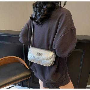 Detailed back view of a silver metallic quilted crossbody bag with stylish chain strap