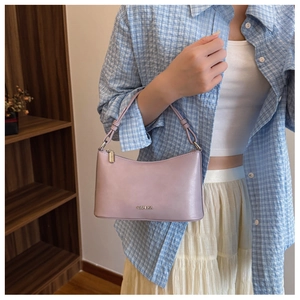 Close-up of the light purple leather hobo bag featuring a metallic logo and zipper detail