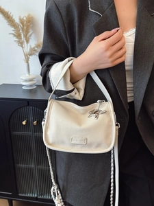 Off-white lychee texture leather shoulder bag with a stylish metal horse charm decoration