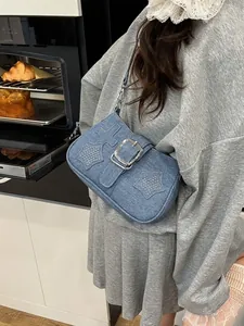 Blue denim shoulder bag with rhinestone stars and large silver buckle for women