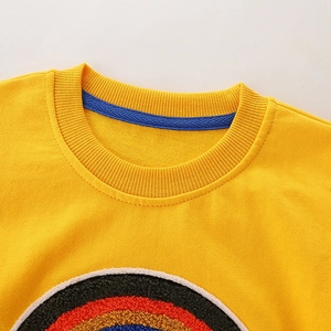 Kids' yellow crewneck sweatshirt with colorful textured loop embroidery on chest