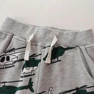 Pantalon de sport gris pour enfants avec imprimé hélicoptère et cordon de serrage