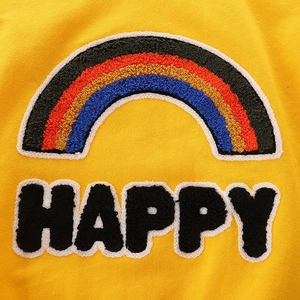 Kids yellow crewneck sweatshirt with colorful rainbow towel embroidery and Happy text