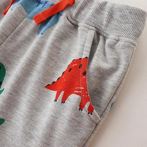 Pantalon de jogging gris pour garçons avec cordon orange et motifs de dinosaures