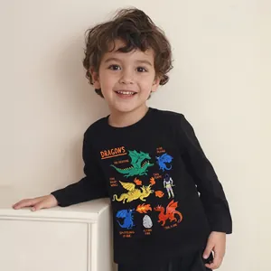 Close-up of kids black cotton sweatshirt featuring colorful cartoon dinosaur graphics