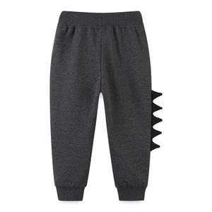 Dark grey boys joggers with 3D dinosaur spikes and elastic waist made of cotton blend