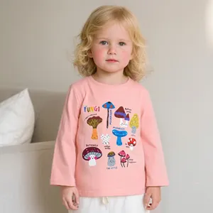 Detail of pink long-sleeve cotton T-shirt featuring colorful mushroom botanical prints
