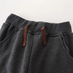 Charcoal grey kids cotton jogger pants with elastic drawstring waist and side pockets