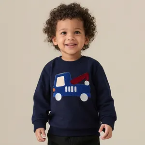 Close-up of crane appliqué embroidery on dark blue long sleeve cotton sweatshirt