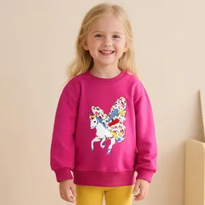 Detail of rose red girls sweatshirt featuring unicorn print and ribbed cuffs