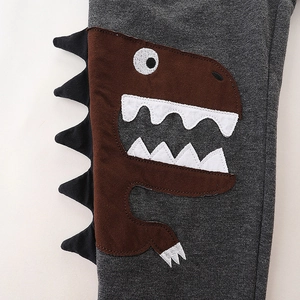 Dark gray cotton kids pants featuring side cartoon dinosaur embroidery and knit texture