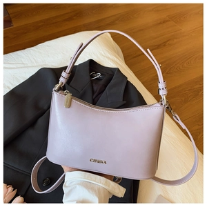 Detail of lavender PU leather shoulder bag with silver hardware and CHHEKA logo