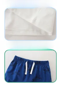 Detailed view of kids knit cotton shorts with elastic waistband and dinosaur print