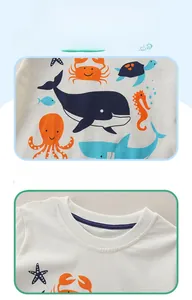 Détail du t-shirt en coton avec col rond et motifs d'animaux marins pour enfants