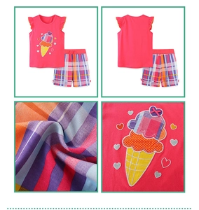 Detail view of girls pink sleeveless top with ice cream embroidery and plaid shorts set