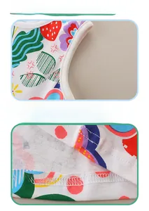 Close-up of cotton girl's dress with strawberry prints and premium hem stitching detail