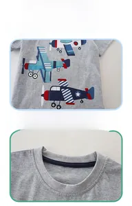 Detail of grey cotton T-shirt featuring cartoon airplane print and blue neck tape