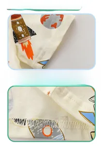 Detail of the double-stitched cuffs and hem on this cotton space-themed kids' T-shirt