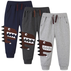 Three-pack of kids cotton sweatpants featuring cute cartoon dinosaur patchwork and 3D back spines