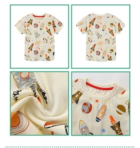 Macro detail of kids cotton T-shirt featuring space rocket and planet cartoon prints