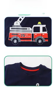 Close-up of cotton navy blue boy's T-shirt with fire truck print and dog embroidery detail
