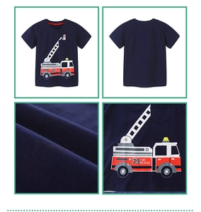 Detail view of navy cotton boy t-shirt showing fire truck print and fabric texture