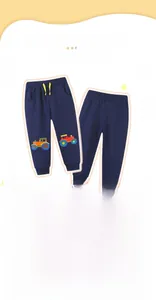 Detail of blue boys joggers featuring colorful tractor embroidery and yellow drawstring