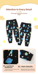 Detail of boys' joggers featuring colorful space cartoon prints and ribbed ankle cuffs