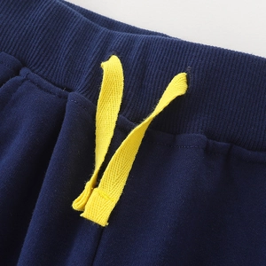 Navy blue boys sweatpants featuring ribbed elastic waistband and yellow drawstring details