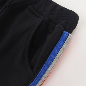 Boys black casual joggers with colorful side stripes and drawstring waist detail
