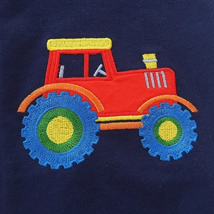Boys navy joggers with detailed cartoon tractor embroidery and ribbed elastic cuffs