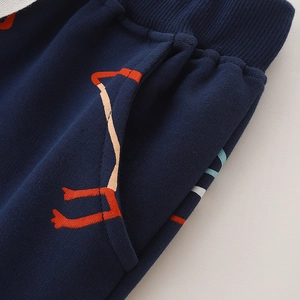 Kids navy joggers featuring an elastic ribbed waistband and vibrant cartoon prints