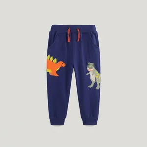 Détail du pantalon enfant en coton bleu marine avec taille élastique et broderie dinosaure