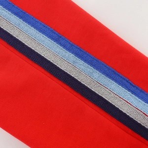 Kids red knit joggers with colorful side stripes and high-quality herringbone texture