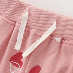Pantalon en tricot rose pour filles avec motifs cœurs rouges et taille élastique