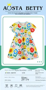 Detail view of cotton knitted girls' dress featuring sunflower and bee print patterns