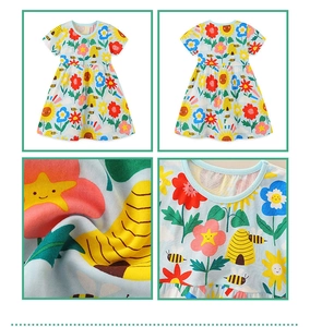 Detail view of cotton floral dress for girls showing bee print and soft fabric texture